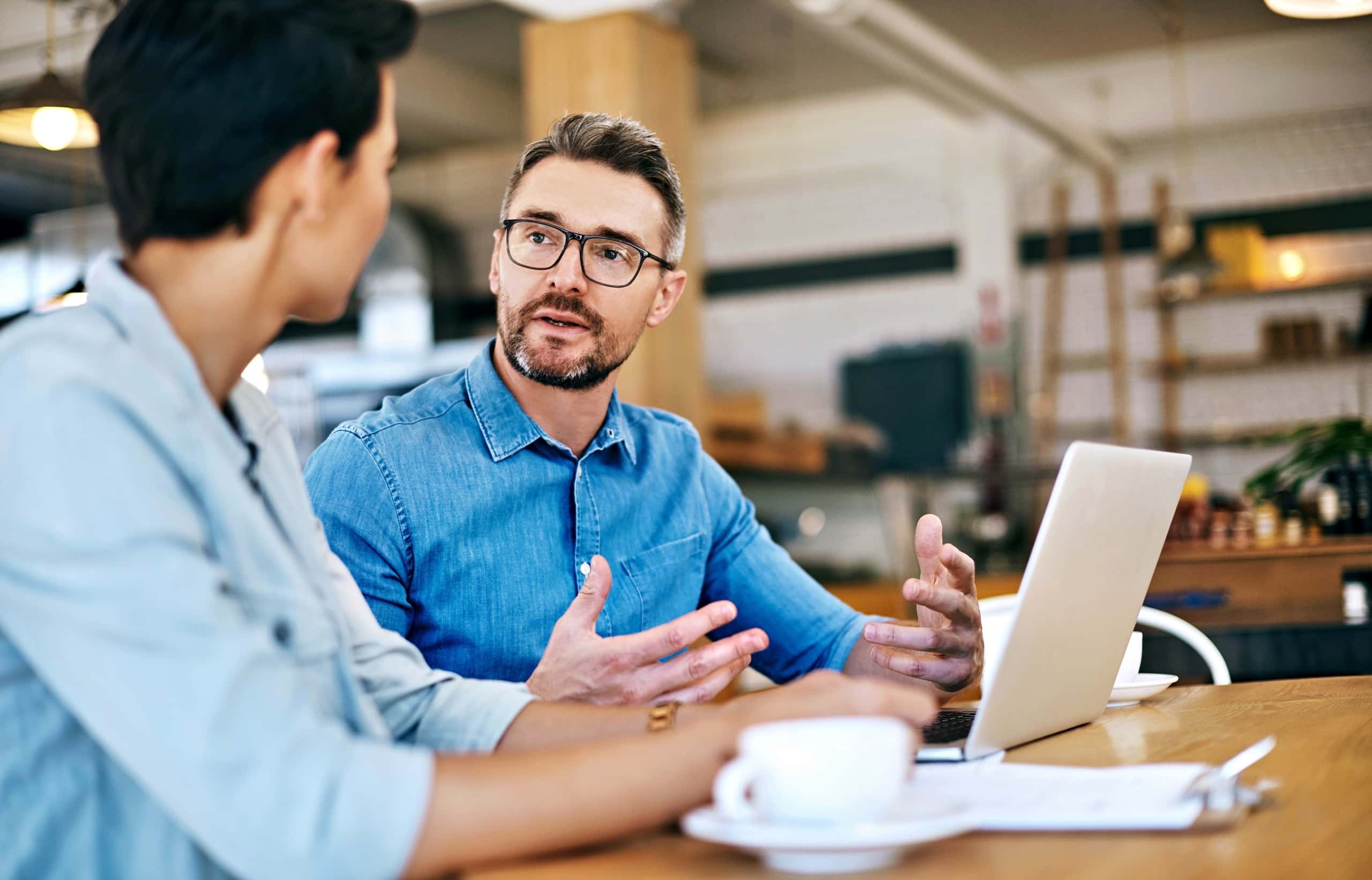 A technical support specialist helping a customer troubleshoot an issue with their laptop