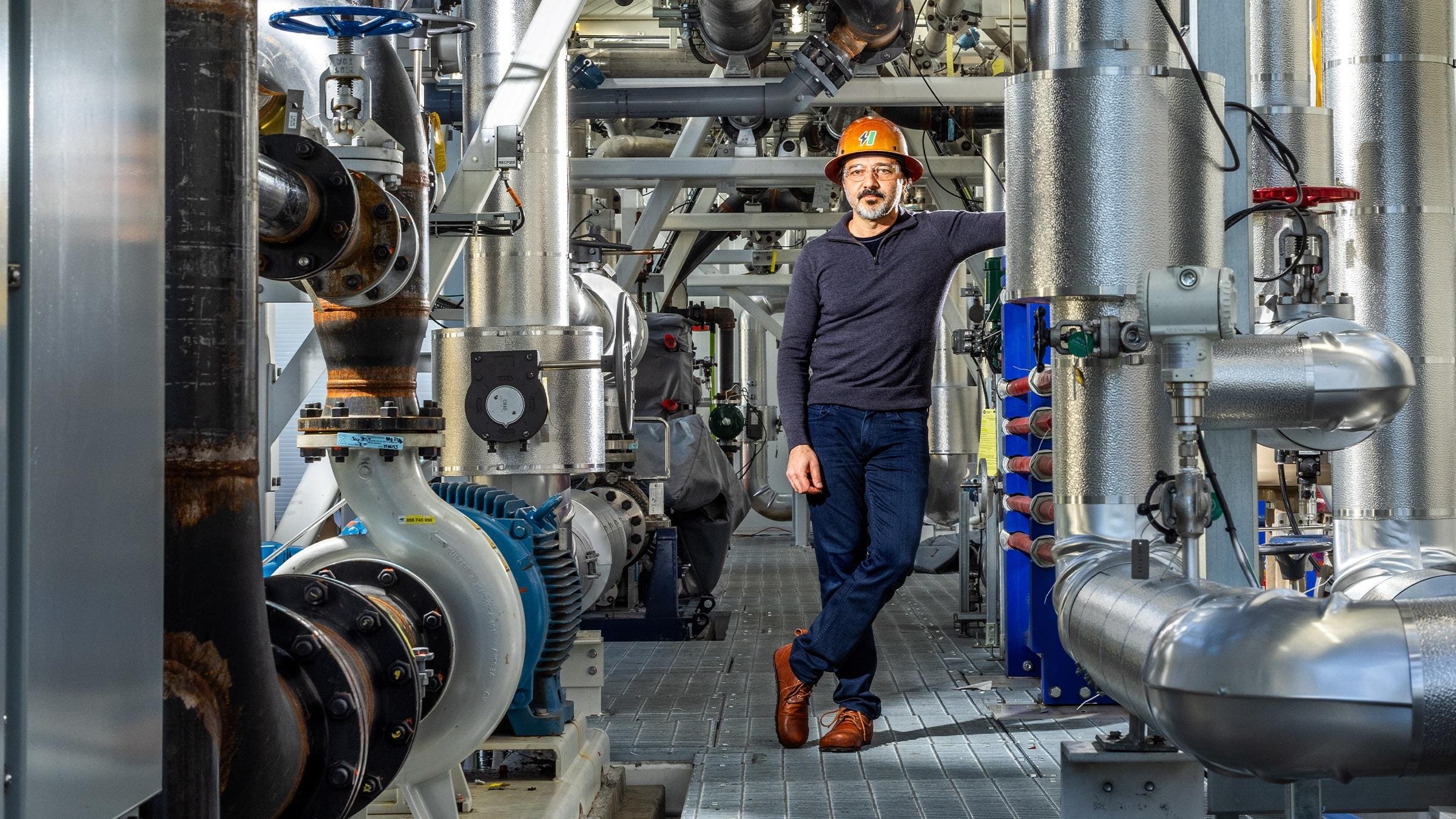 Man in a hard hat standing in a factory