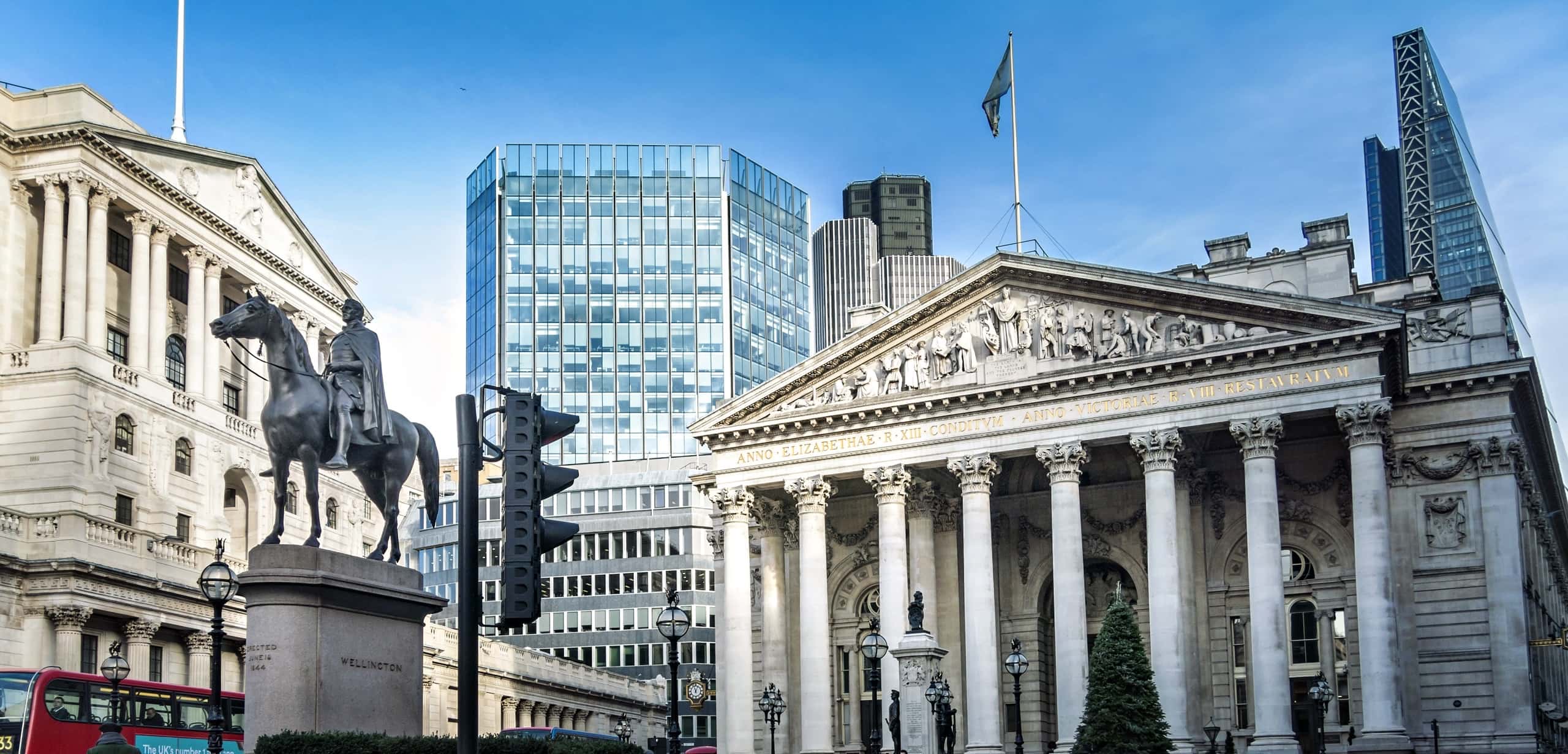 Building with columns and a statue in front of it