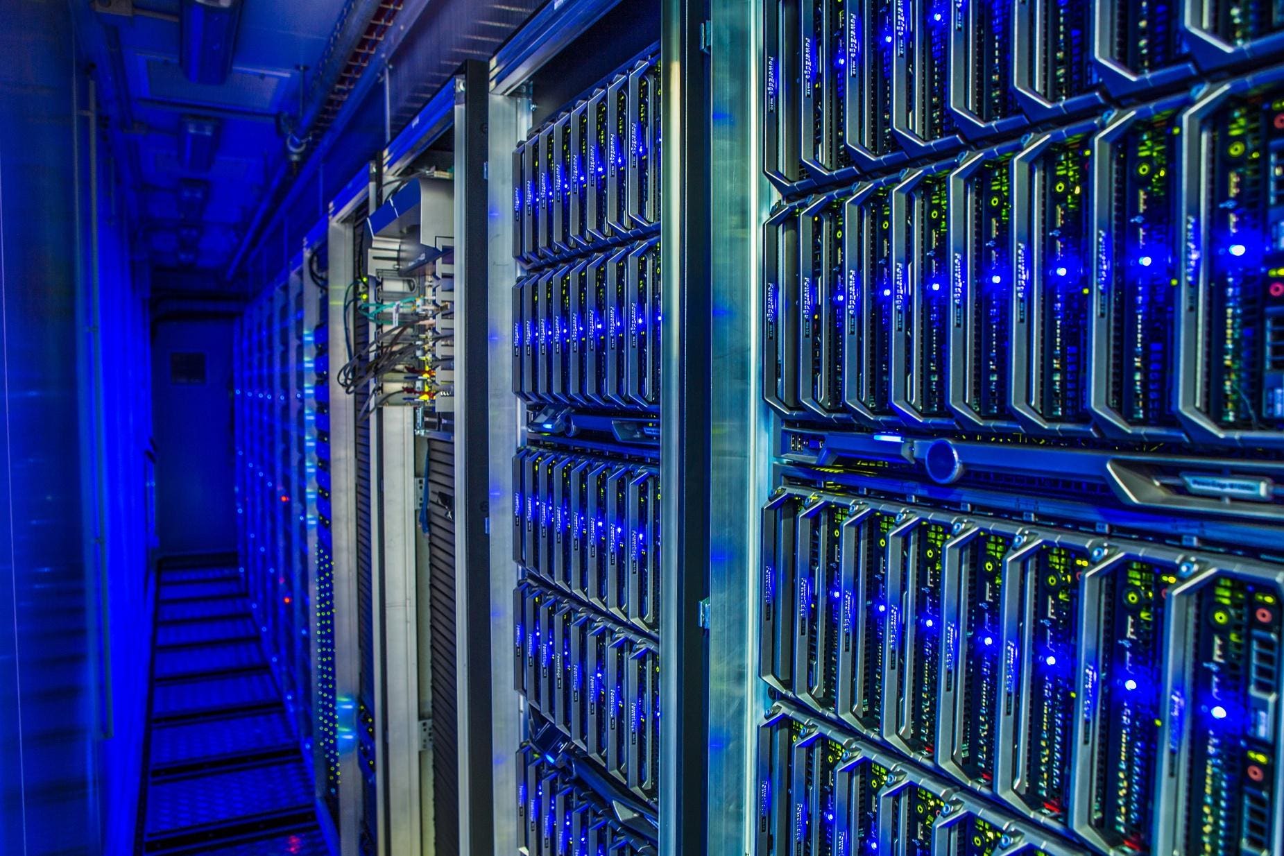 A row of servers in a data center, representing the secure and reliable data storage and protection offered by Fast Fixx's data security solutions